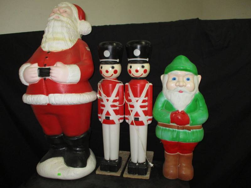 lot 51 image: Large plastic figure christmas decorations, only 12 working lights plastic nutcracker, plastic santa, broken lights gnome, christmas decorations