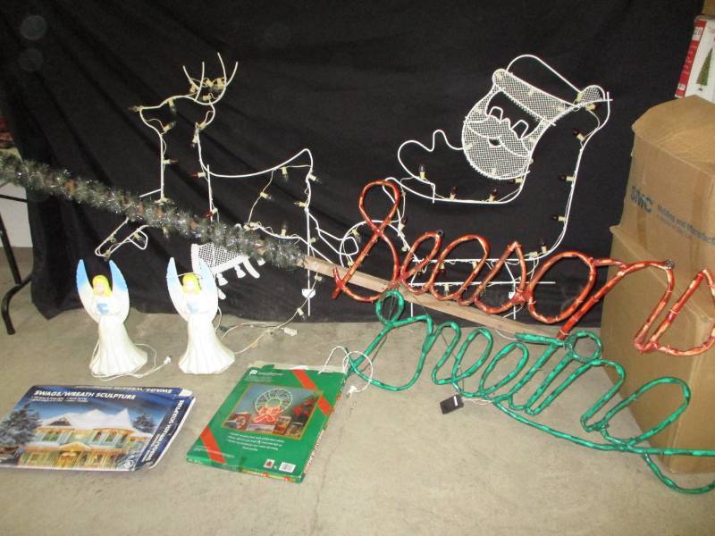 lot 68 image: Large lighted Santa, deer, seasons Greeting, 2 angels, most everything works, may need a few new bulbs.