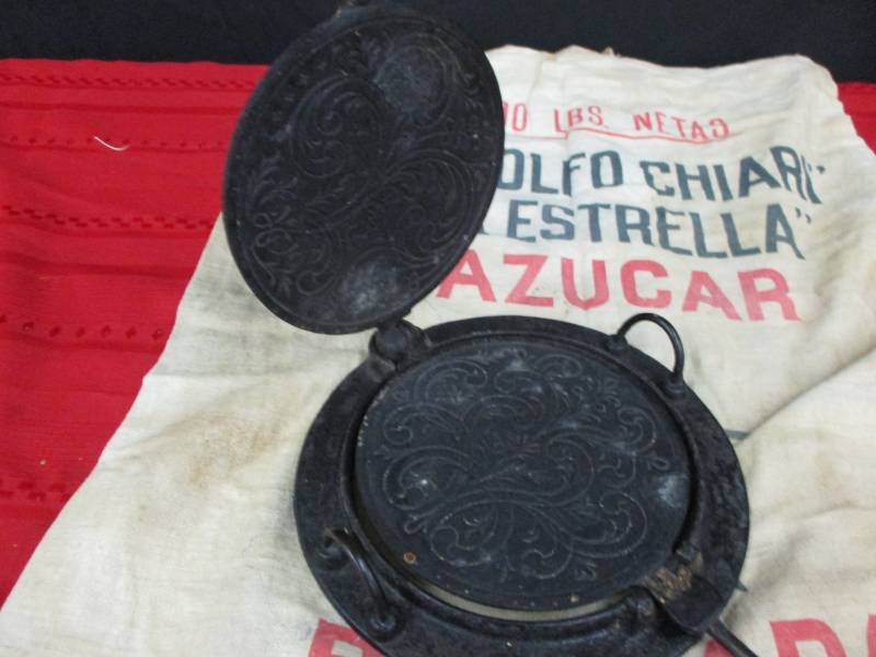 lot 83 image: Krumkaka Iron and 100 pound Bag