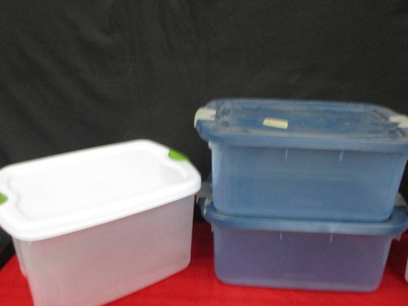 lot 85 image: Four large plastic containers with lids