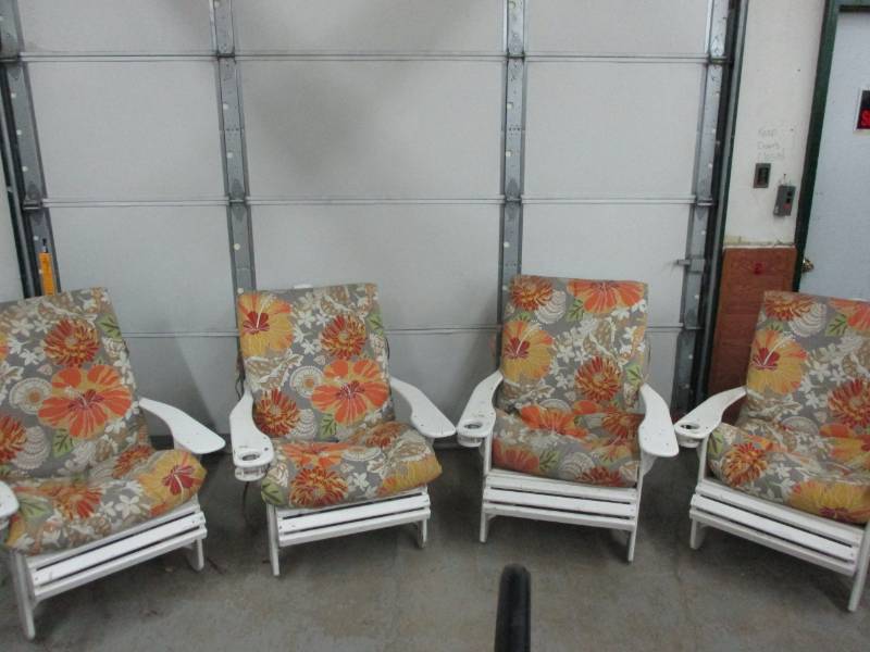 lot 86 image: four white outdoor patio chairs with floral design cushions