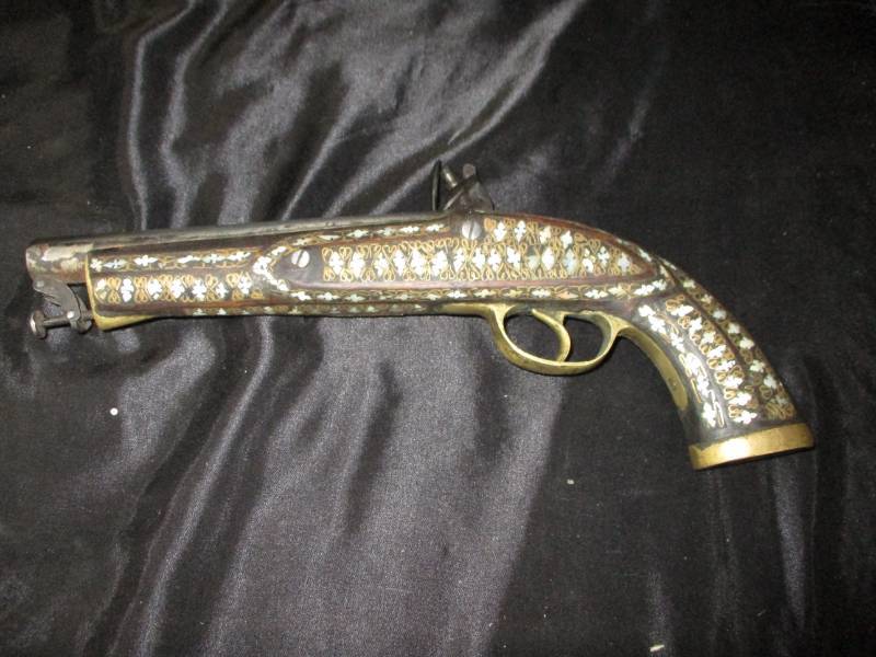 lot 8 image: Pre 1850 fully functional flint style black powder dueling pistol.  Fantastic inlay of mother of pearl and brass   Barrel has been cleaned up  number stamped 1833