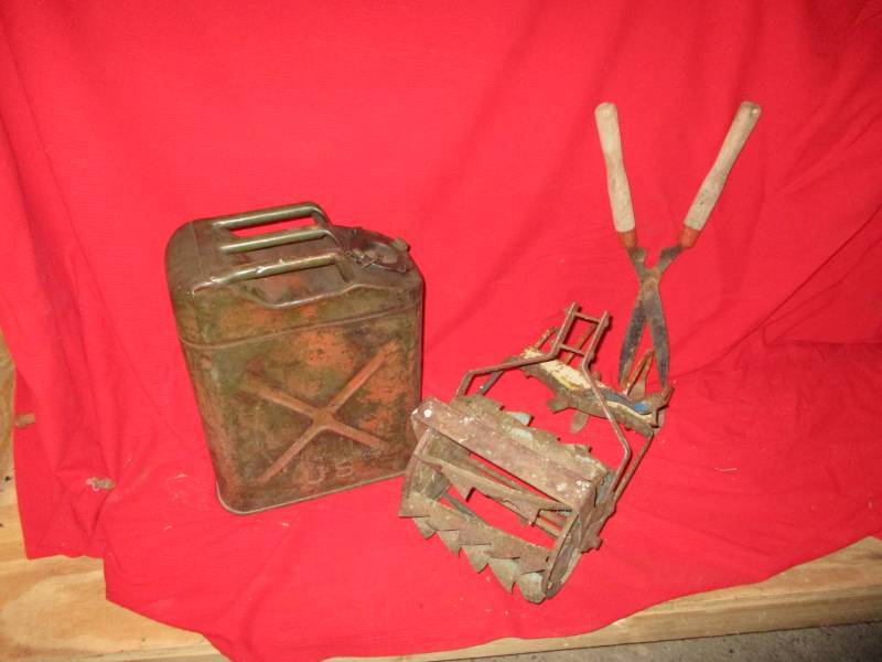 lot 32 image: Metal Gas Can and Hand Cultivator