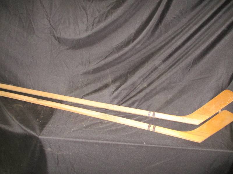 lot 74 image: 2 antique wood hockey sticks