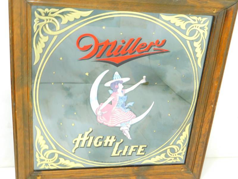 lot 14 image: Framed Miller High Life Girl in Moon Poster