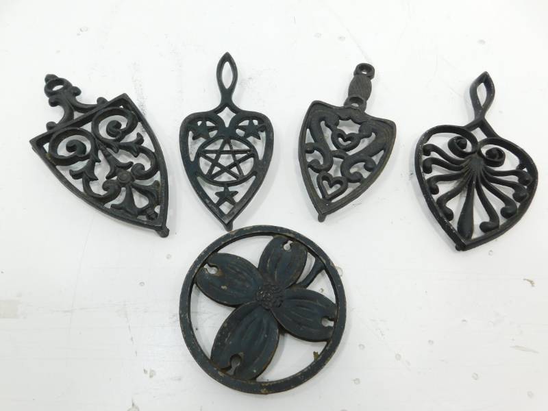 lot 119 image: Five Decorative Cast Iron Trivets
