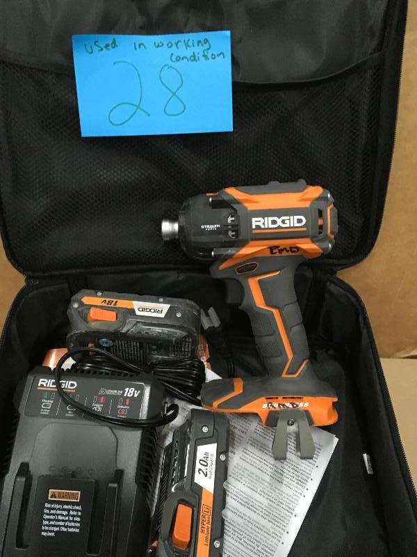 lot 28 image: RIDGID STEALTH FORCE Brushless 18-Volt Hyper Lithium-Ion 14 in. Cordless Pulse Driver Kit Used in working condition.
