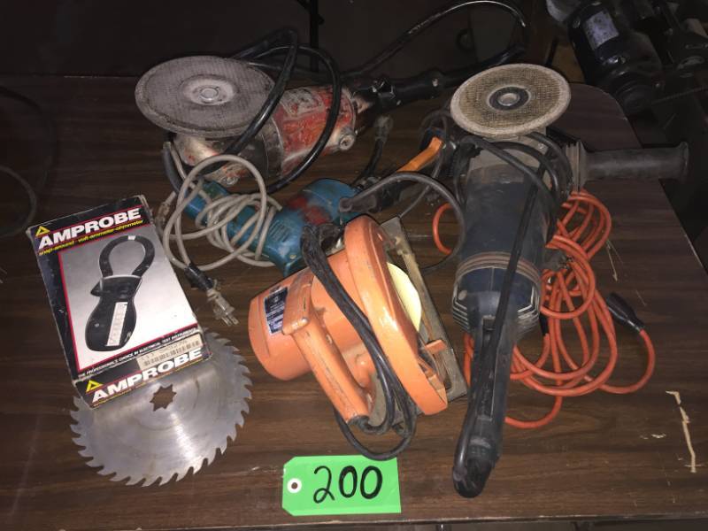 lot 200 image: 3-angle grinders (1-  Black Decker, 1-Makita, 1 Bosch), 1-extension cord, 1-ampprobe (snap around volt ammeter-ohmmeter), Skilsaw 7.25, Makita 10mm drilll