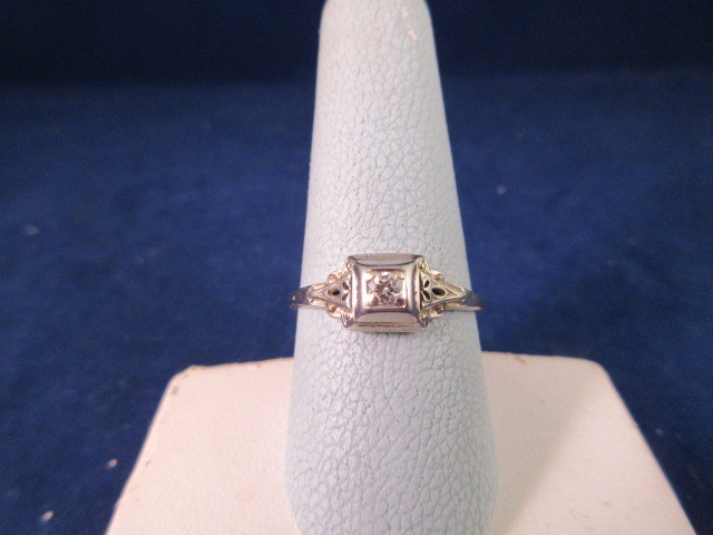 lot 834 image: 18K WHITE GOLD DIAMOND ENGAGEMENT RING SIZE 8 34