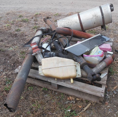 lot 96 image: Pallet of mufflers and related components from International DT 466  Brinks Armored Truck  Car