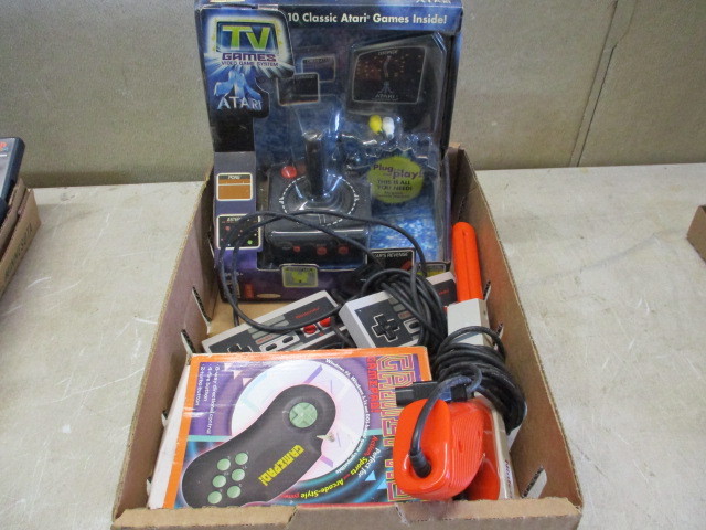 lot 17 image: Vintage Atari & Nintendo Games with NOS Accessories