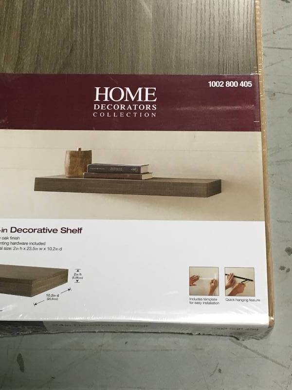 lot 58 image: Home Decorators Collection 23.6 in. W x 10.2 in. D x 2 in H Driftwood Gray Oak Floating Shelf not used
