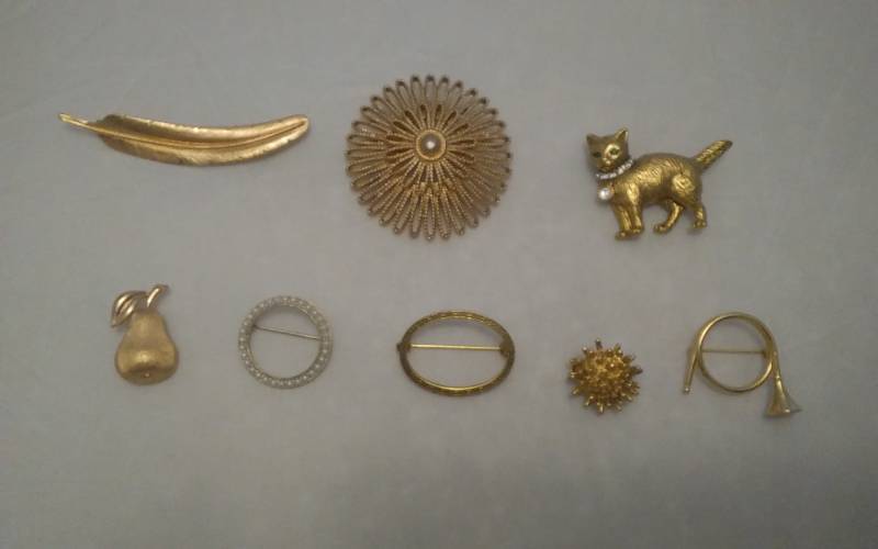 8-Assorted Brooches (Trifari, Monet, MMA)