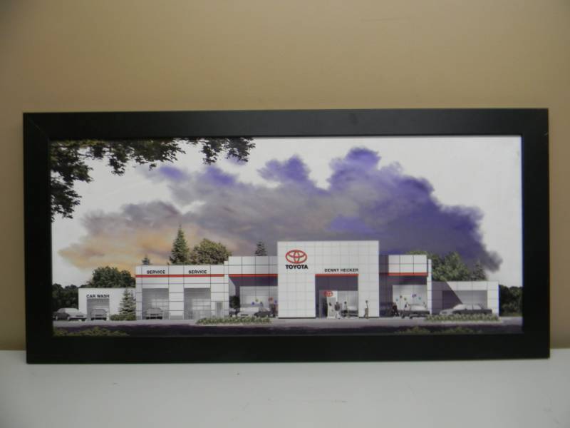 lot 1 image: DENNY HECKER TOYOTA FRAMED PICTURE - APPROX 39 BY 19 WITH A DENNY HECKER GOLF SHIRT SIZE M