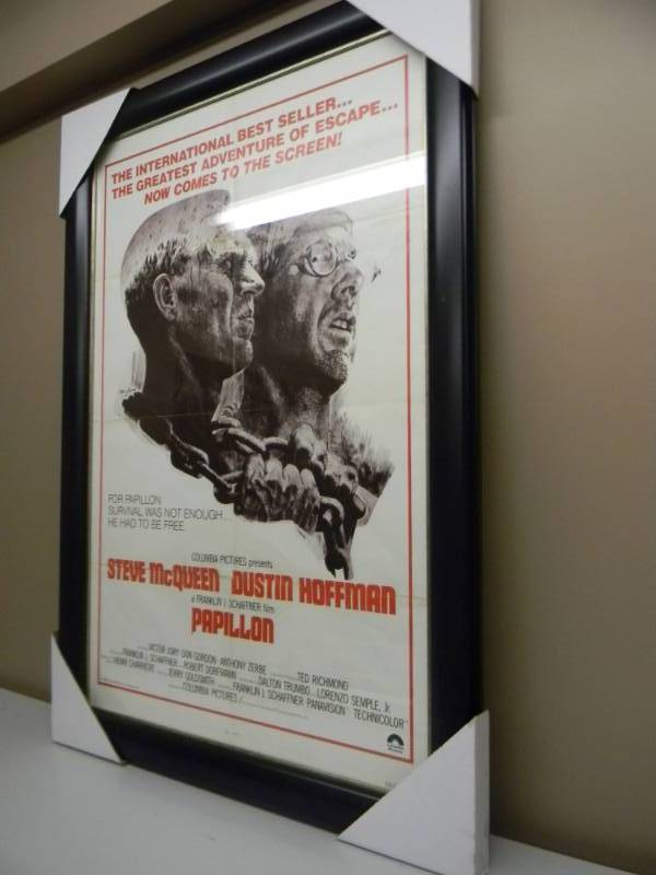 lot 4 image: PAPILLON - PROFESSIONALLY FRAMED MOVIE POSTER - THE REAL DEAL - STEVE McQUEEN, DUSTIN HOFFMAN - APPROX 31 BY 44 - SEE PICTURES