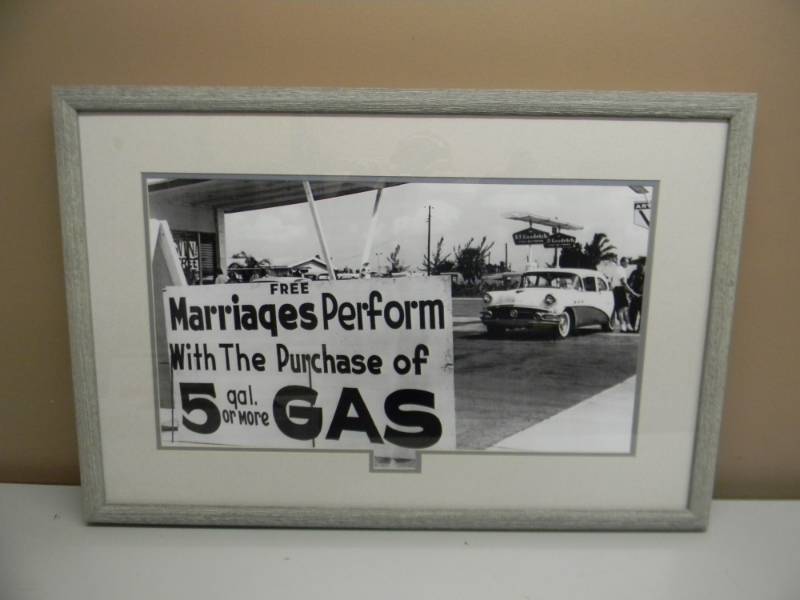 lot 23 image: FREE MARRIAGES WITH FIVE GALLONS OF GAS - REAL PICTURE - ALWAYS GETS A SMILE - FRAMED - SEE PICTURES