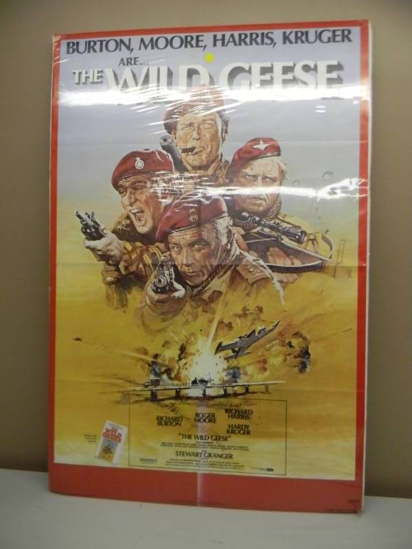lot 29 image: THE WILD GEESE ORIGINAL MOVIE POSTER - LARGE APPROX 28 BY 42 - VERY GOOD DISPLAY PIECE - SEE PICTURES