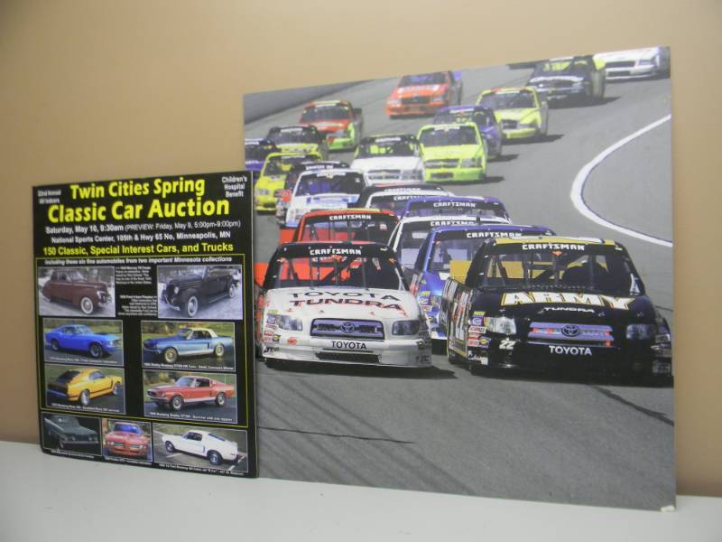 lot 41 image: 2 VINTAGE AUTO SIGNS RACING & AUCTION ADVERTISING POSTERS ON HARDBOARD - LARGE & MEDIUM SIZE - SEE PICTURES