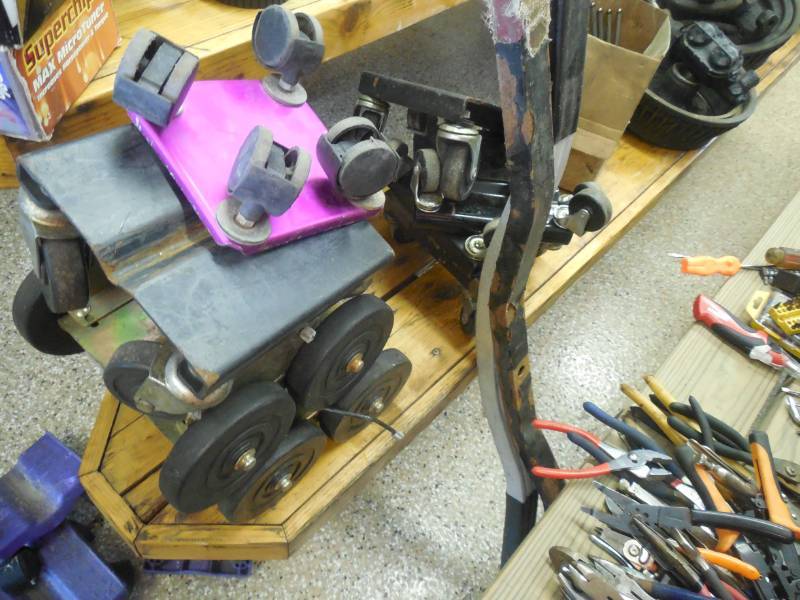 3 SETS OF SNOWMOBILE DOLLYS & 2 TRAILER TIE DOWNS