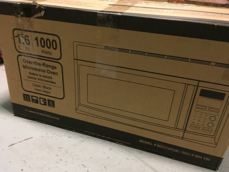 lot 40 image: Magic Chef 1.6 cu. ft. Over the Range Microwave in Black not used