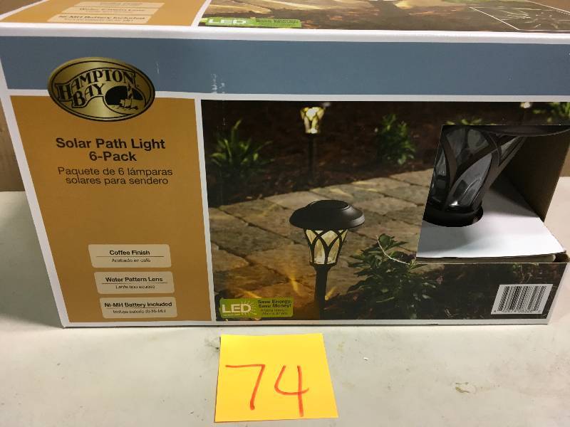lot 74 image: Hampton Bay Solar Bronze Outdoor Integrated LED Landscape Fan Cage Path Light with Water Glass Lens (6-Pack) not used