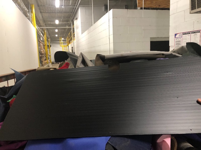 lot 102 image: Assorted Rolls of Various Nylon Fabrics suitable for making Backpacks, tents, BoatCar covers, etc indooroutdoor use-  Plus signage boards - black Cart NOT included