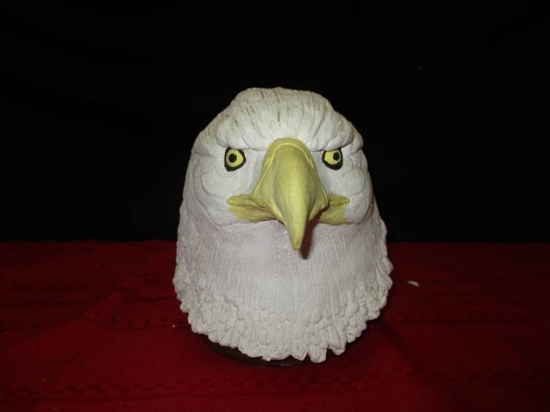 lot 15 image: Eagle head coin holderpiggy bank