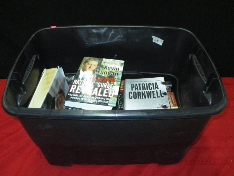 lot 27 image: Various books with plastic container