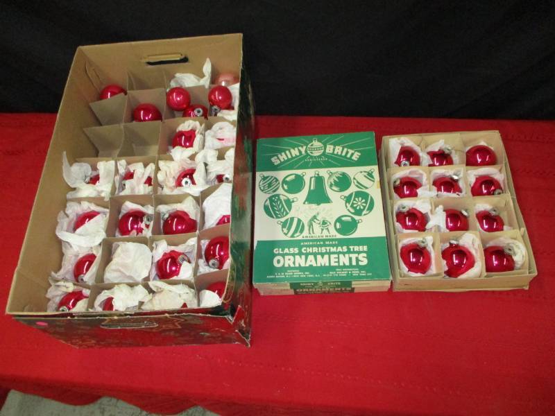 lot 94 image: Pink tree ornaments, large box with various shades of pink on each layer