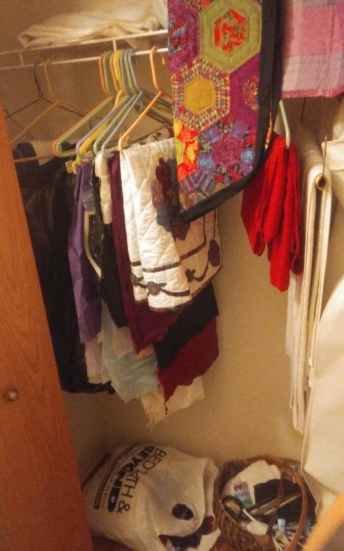 lot 53 image: Contents Of Linen Closet & Hall Closet  Table Linens, Candles, PartyPicnic Ware, Other TextilesSewing Craft