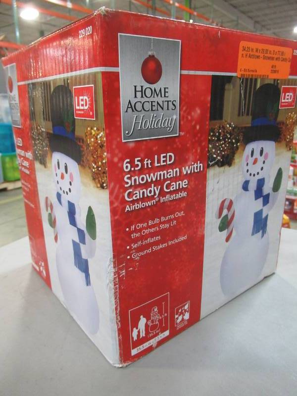 lot 10 image: Home Accents Holiday 34.25 in. W x 29.92 in. D x 77.95 in. H Airblown-Snowman with Candy Cane, Model 15561