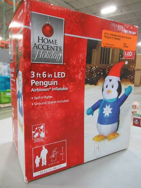 lot 19 image: Home Accents Holiday 42 in. Inflatable Airblown Outdoor Penguin in Sweater, Model 39414