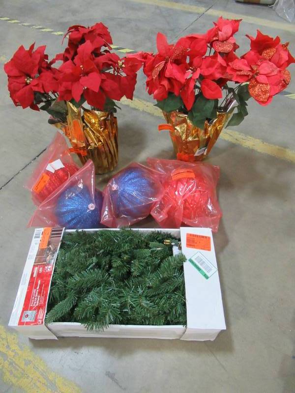 lot 58A image: Home Accents Holiday 9 ft. Pre-Lit LED Sierra Nevada Garland with Warm White Lights, 4 Large Ornaments and 2 Poinsettia silk plants.