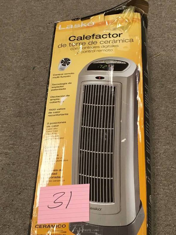 lot 31 image: Lasko 23 in. 1500-Watt Ceramic Tower Heater with Digital Display and Remote Control  in good working condition