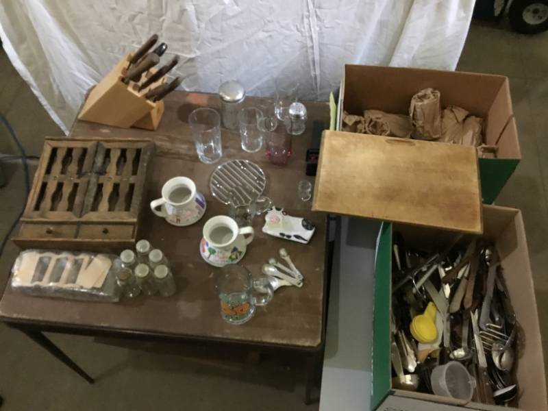 lot 56 image: Large Lot of Kitchenware  Silverware, Glasses Spice rack and jars, Mugs, cutting board