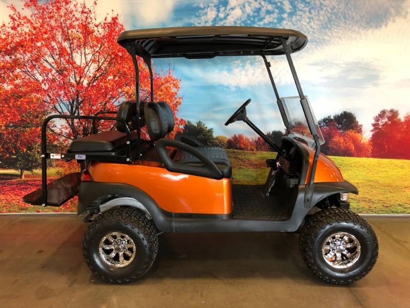 Atomic Orange Club Car Four Passenger Lifted Golf Cart