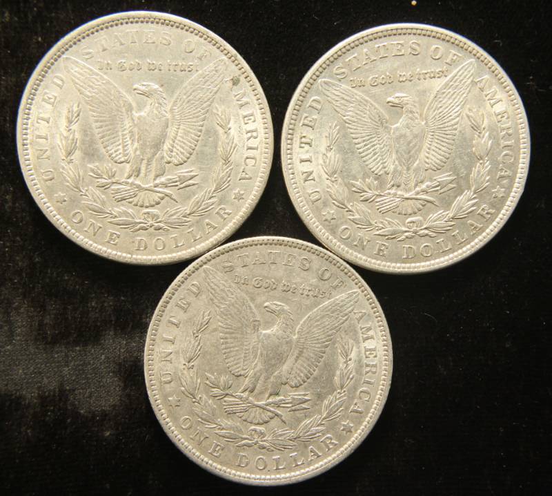GROUP OF 3 AU-UNC MORGAN SILVER DOLLARS