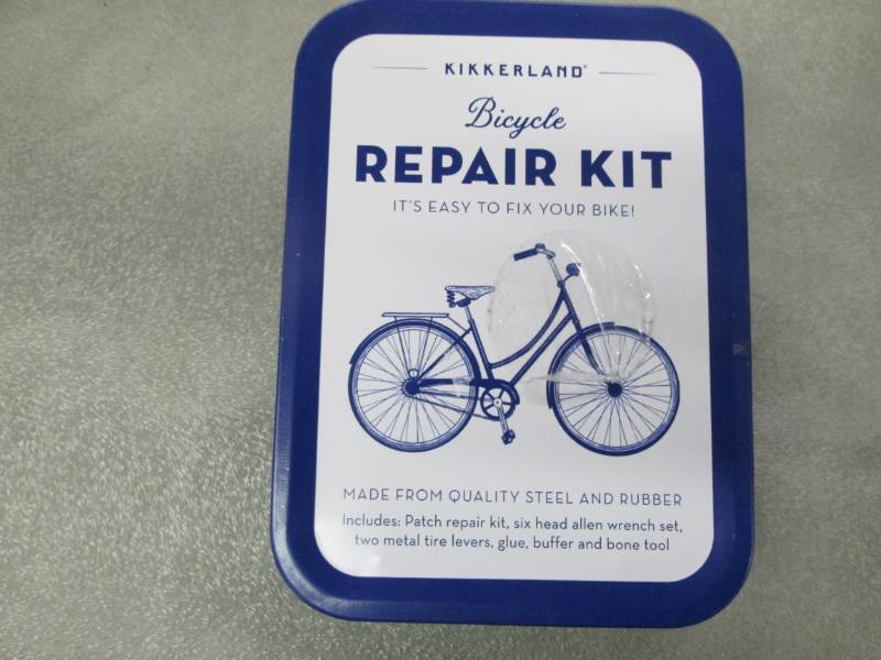 lot 124 image: Kikkerland Bike Repair Kit Tin...