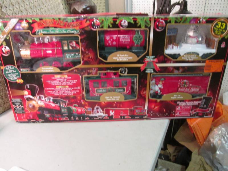 lot 17 image: North Pole Express 33 piece Christm...