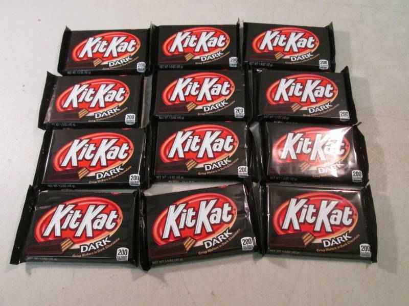 lot 261 image: 12 Kit Kat Dark Chocolate Candy Bar...