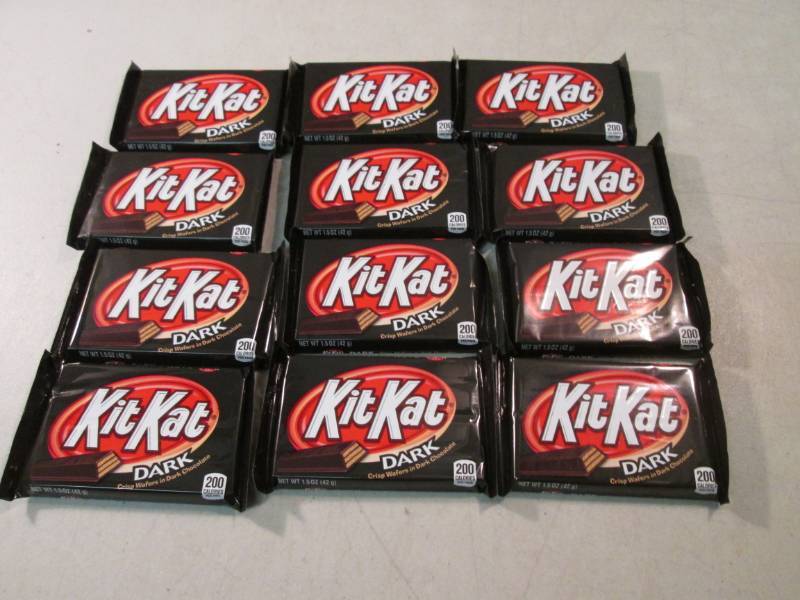 lot 262 image: 12 Kit Kat Dark Chocolate Candy Bar...