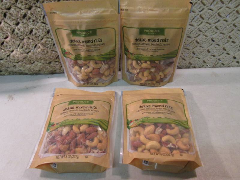 lot 285 image: 4 Bags of Deluxe Mixed Nuts Best by...