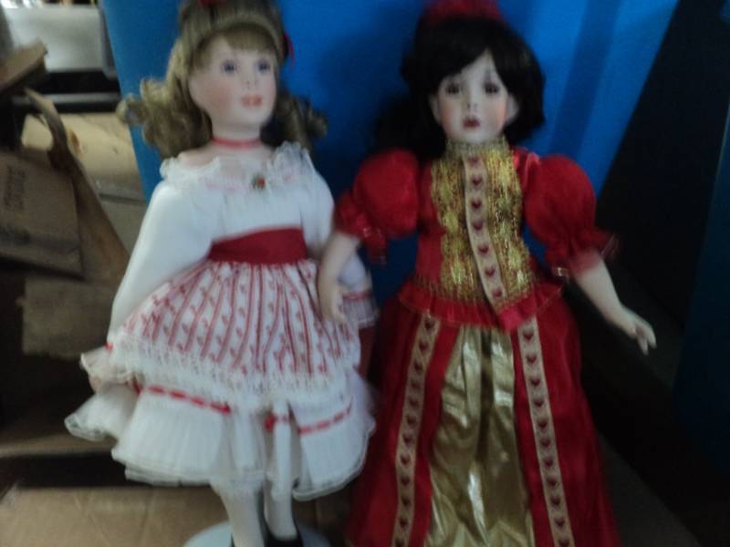 2 porcelain dolls numbered with sta...