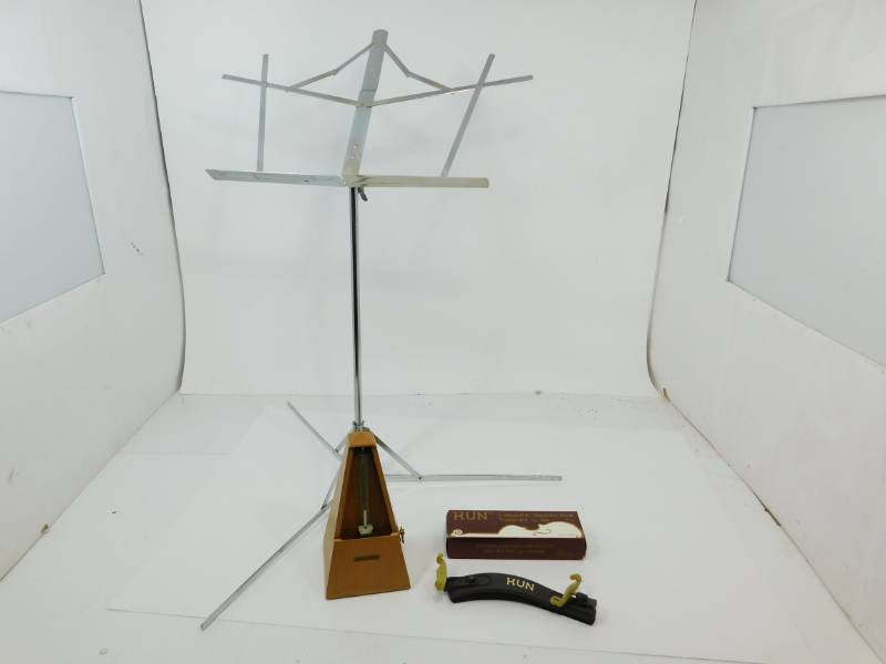 lot 30 image: Sheet Music Stand & KUN Collapsible Shoulder Rest Violin 44  No.300C & Seth Thomas Maple Pyramid Metronome