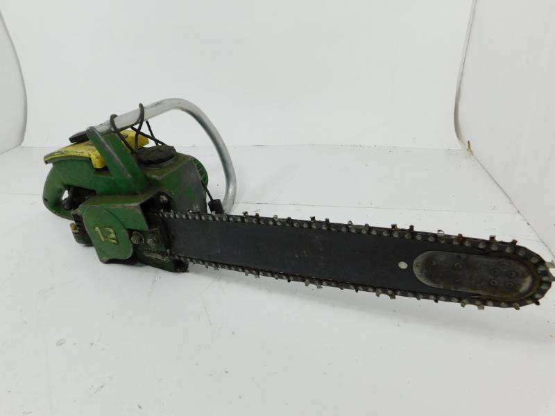 lot 37 image: Old John Deere 12 Chainsaw