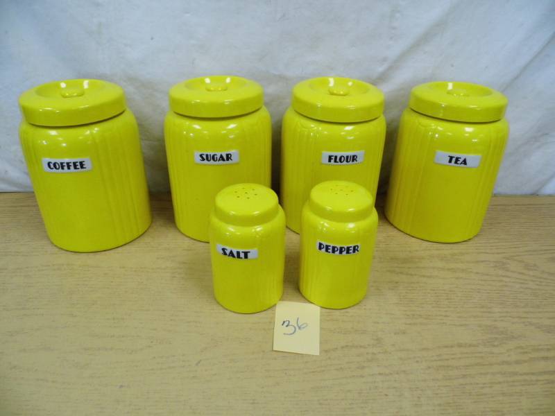 lot 36 image: Lot of Yellow Halls Canisters