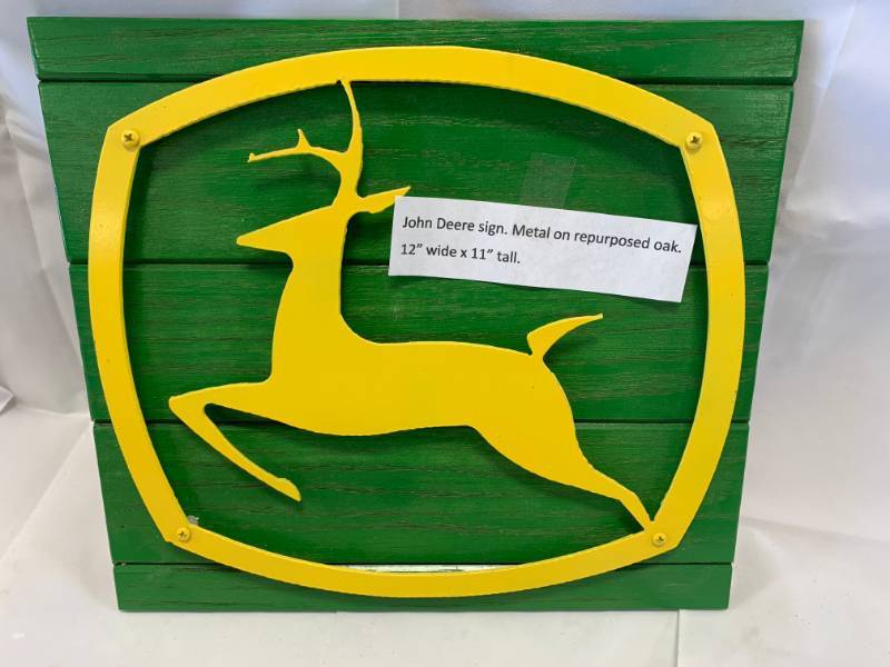 John Deere Metal Sign on Oak
