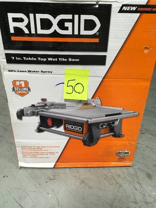 lot 50 image: RIDGID 120-Volt 7 in. Table Top Wet Tile Saw In good condition.