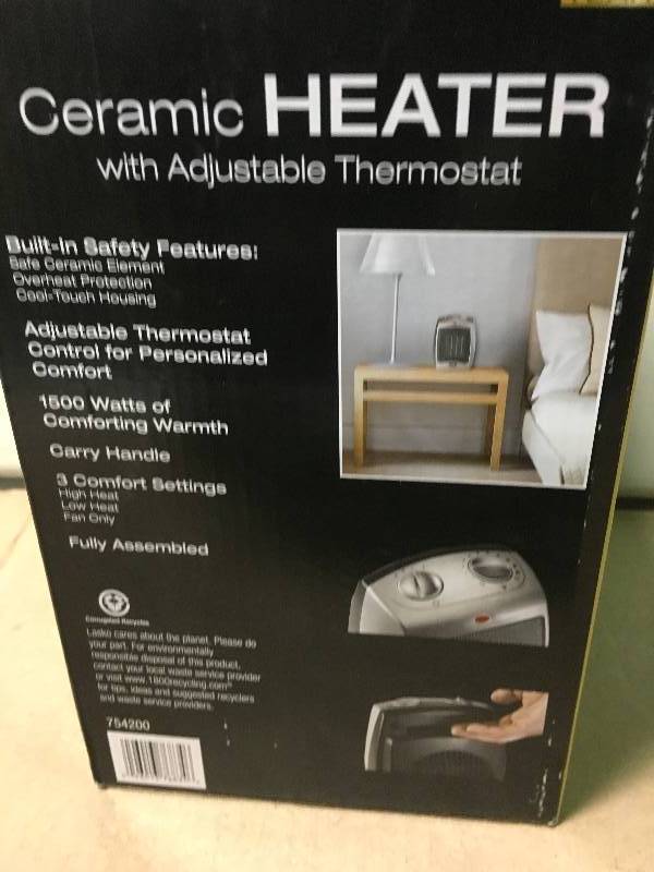 lot 12 image: Lasko 9.2 in. 1500-Watt Electric Portable Ceramic Compact Heater  in good working condition