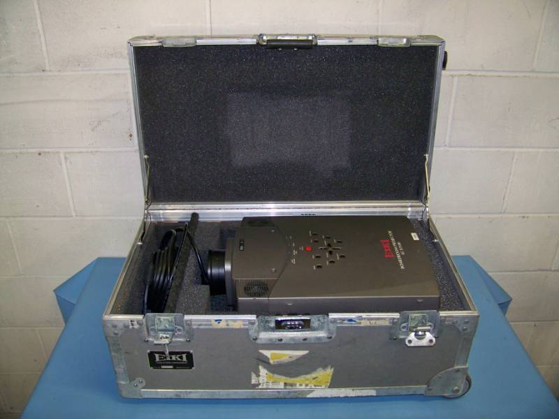 lot 69 image: EIKI, LC-X1100, LCD Projector with Remote Control in Hard Sided, Padded Inside Travel  Shipping Case with Telescoping Handle on Wheels